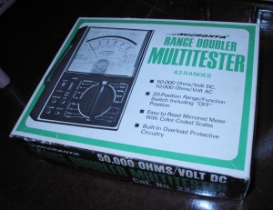 Analog multimeter in its original box.
