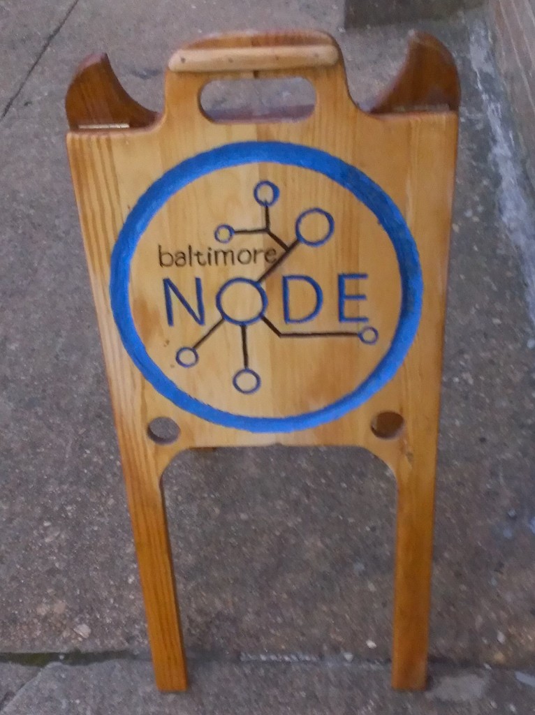 hand-carved wooden Node sign